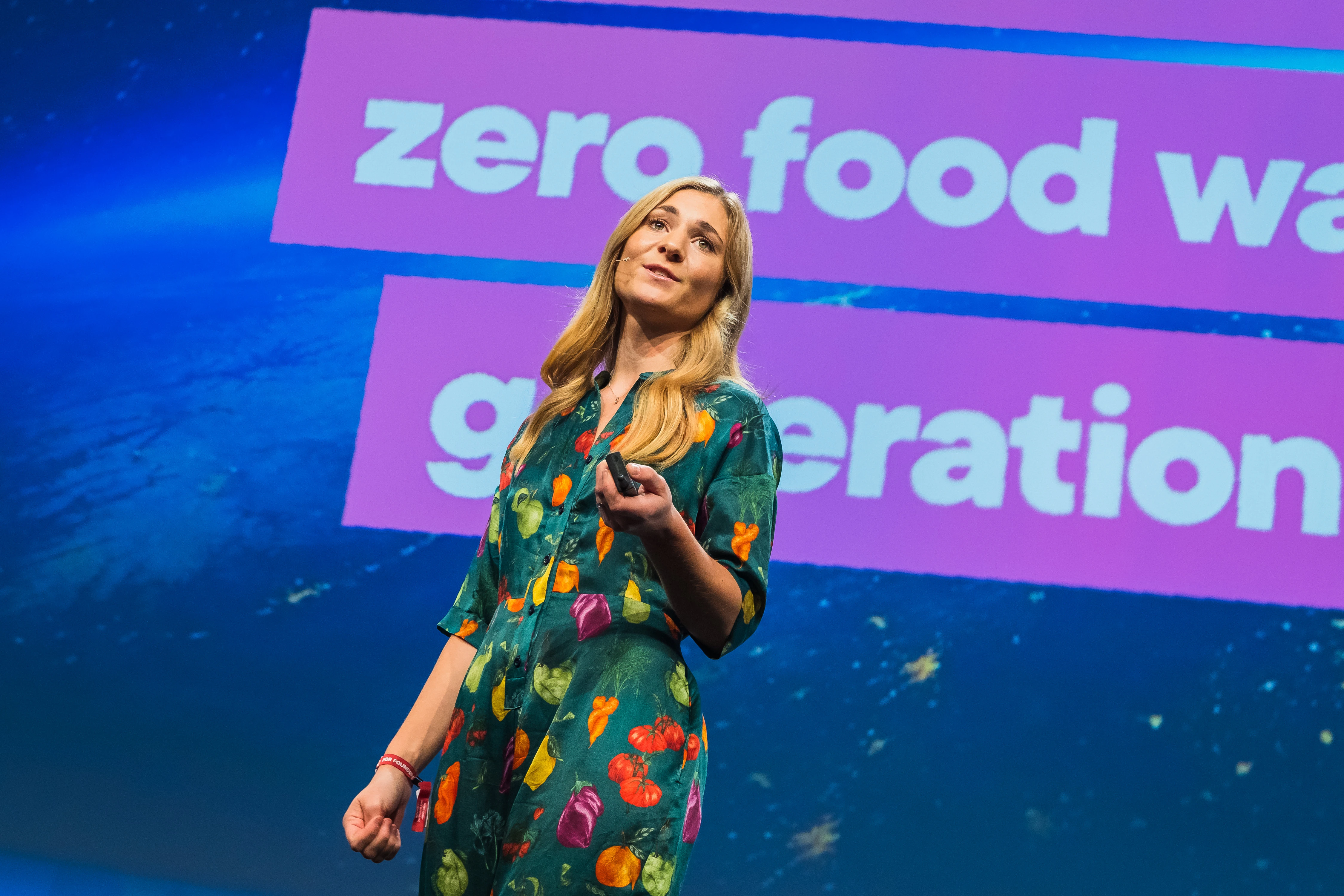 Bits & Pretzels 2019 - Speaker addressing zero food waste, projected backdrop