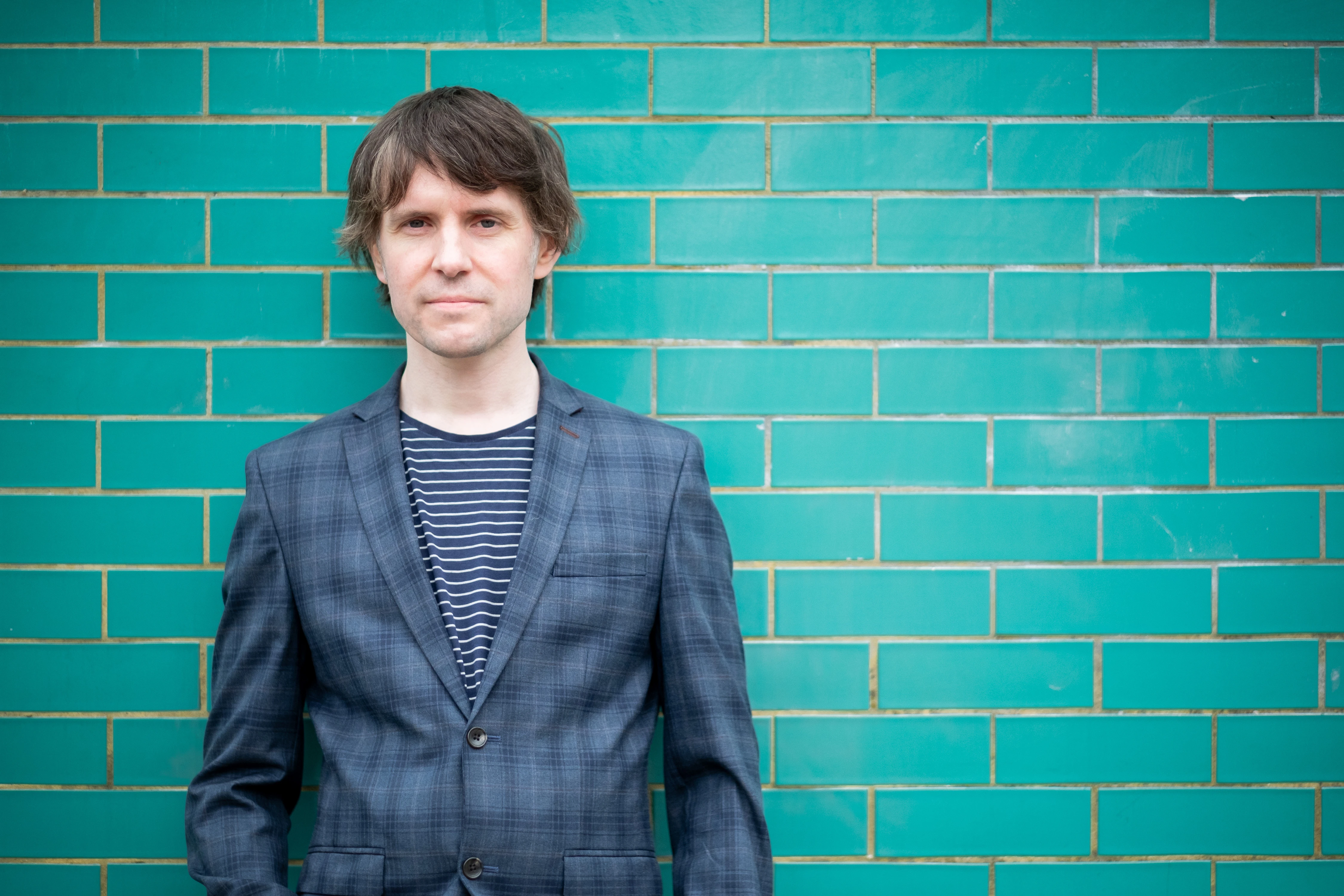 Martin Bryant Personal Branding Headshots - Three-quarter portrait, teal tiled wall