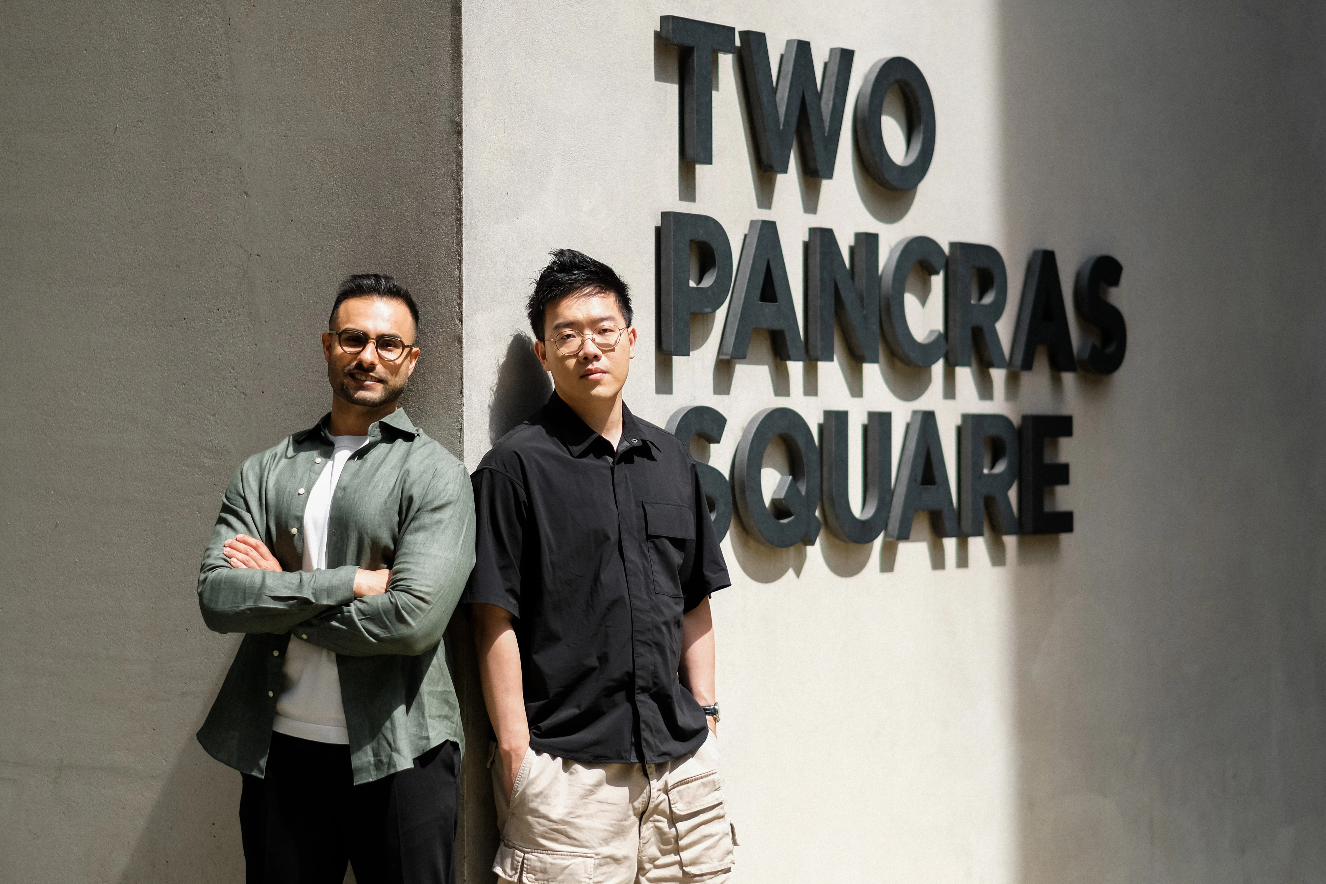 Zaro.ai Founder Portraits - Founders at Two Pancras Square fountain, wide duo shot